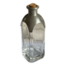 Glass and tin bottle