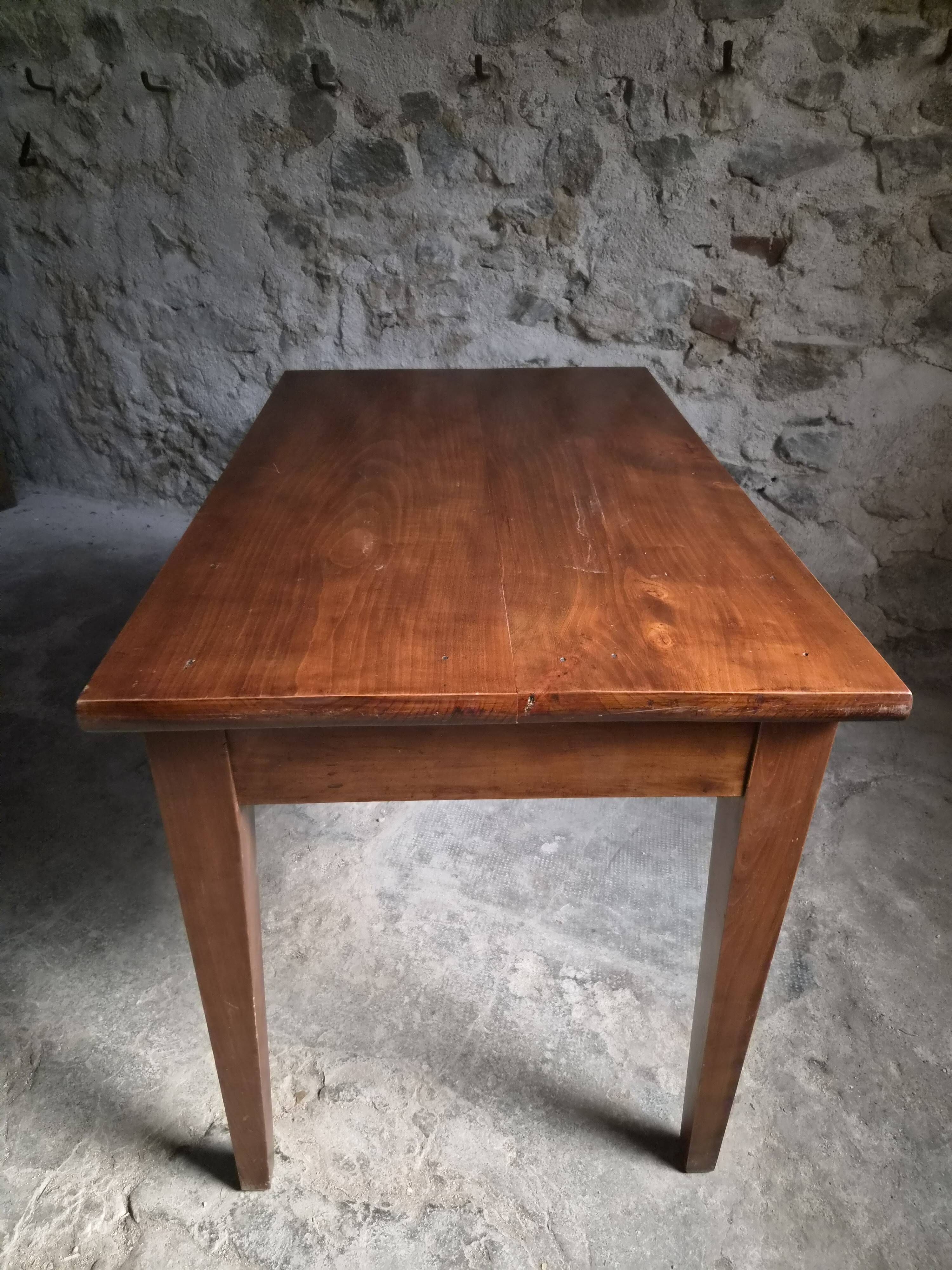 Old French table in cherry wood with bistro chair, circa 1900–1930.