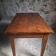 Old French table in cherry wood with bistro chair, circa 1900–1930.