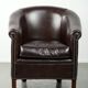 Dark cow leather club armchair with a stylish design in English style