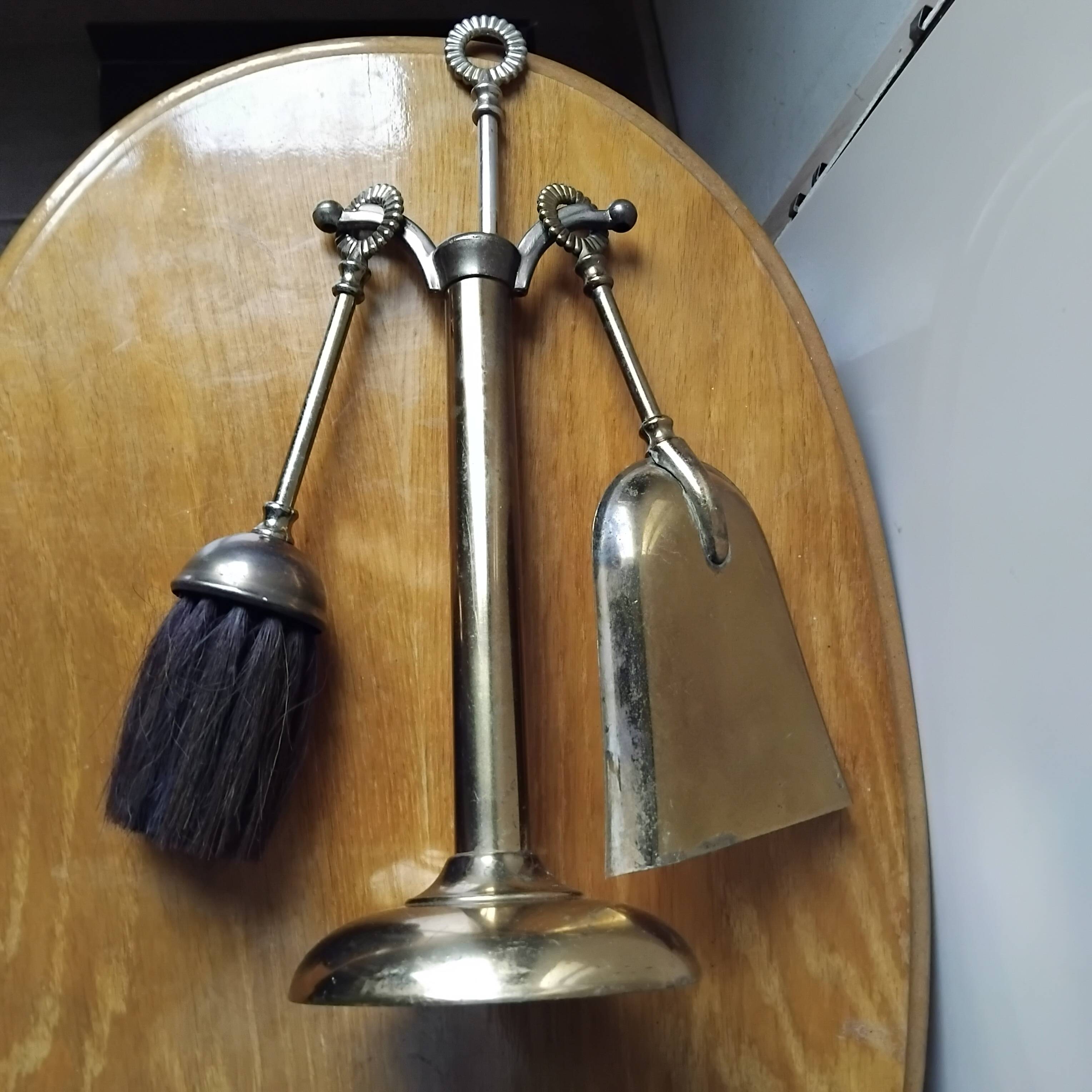 Small and discreet brass fireplace tool set.