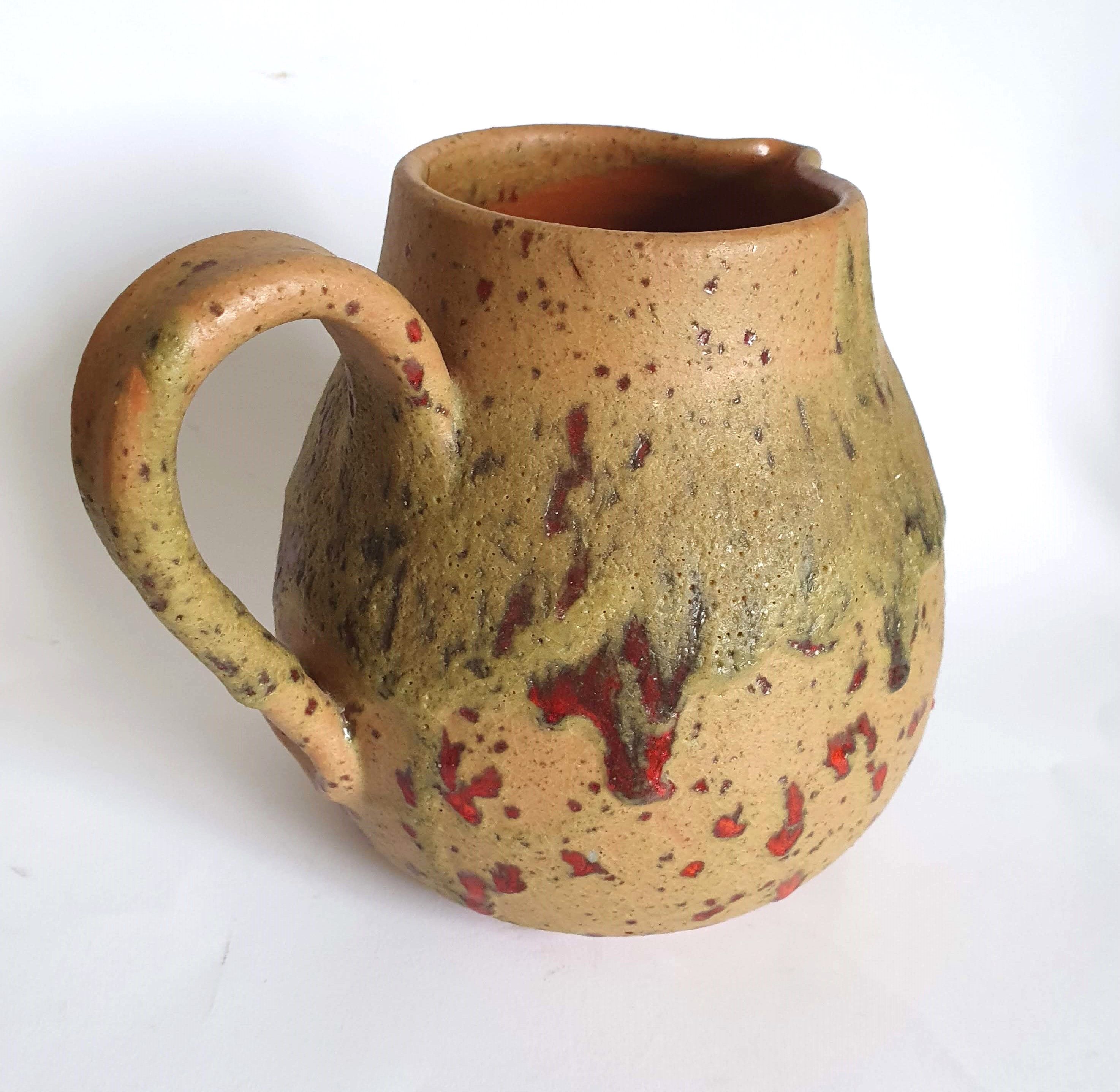 Red speckled stoneware pitcher by Campo Piano Orezza
