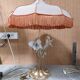 Large gilded brass lamp with white porcelain fleur-de-lis decoration