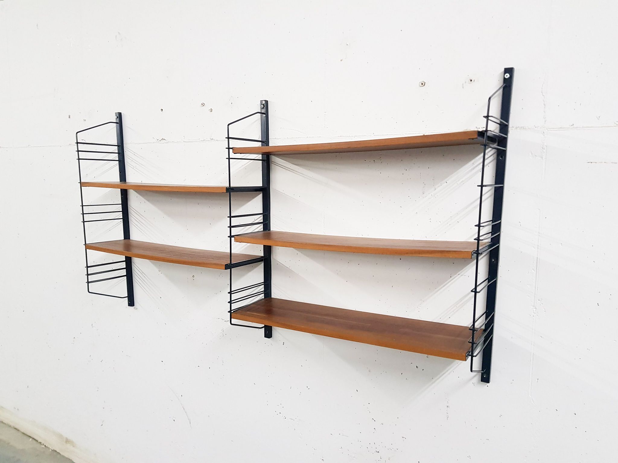 Mid-century book shelves in the style of Tomado