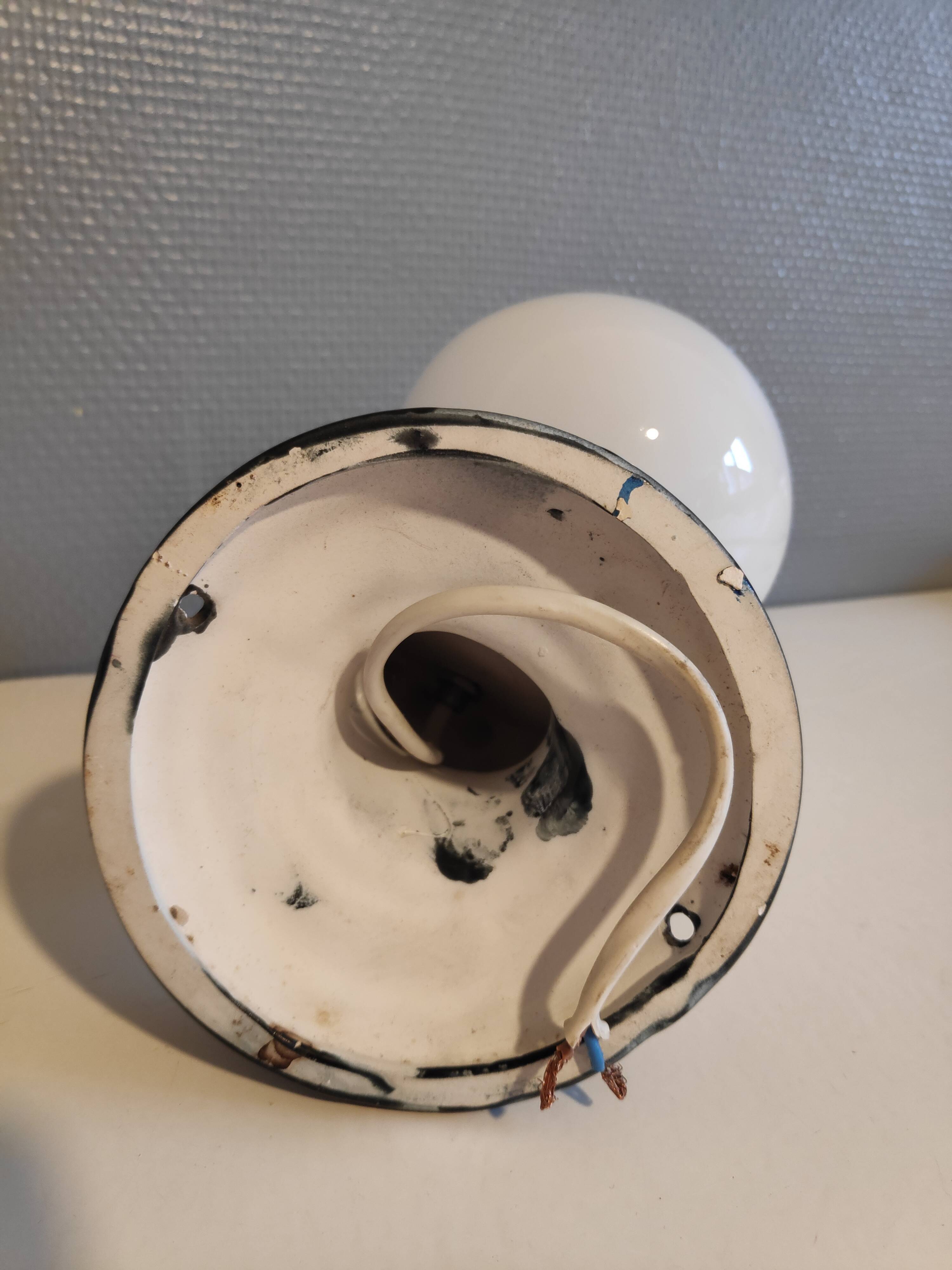 Black ceramic handand white opaline ball sconce