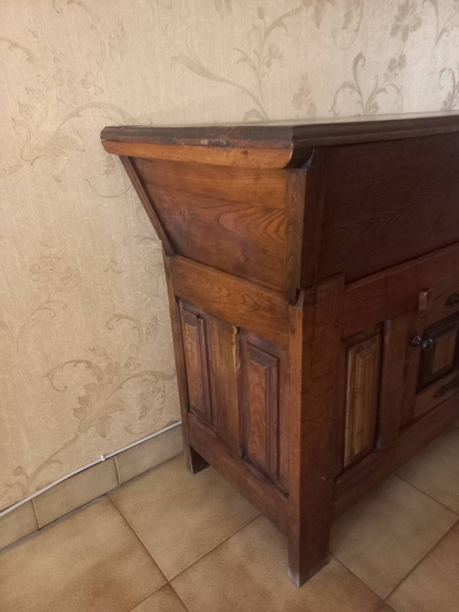 Old solid wood dough mixer carefully transformed into a bar cabinet.