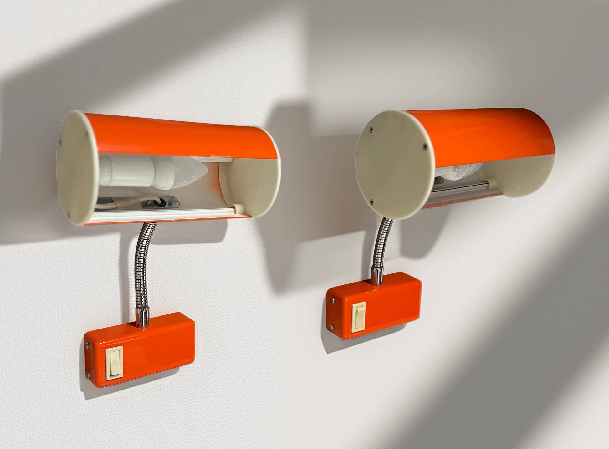 Pair of orange wall sconces from the 1970s by Ateljé Lyktan.