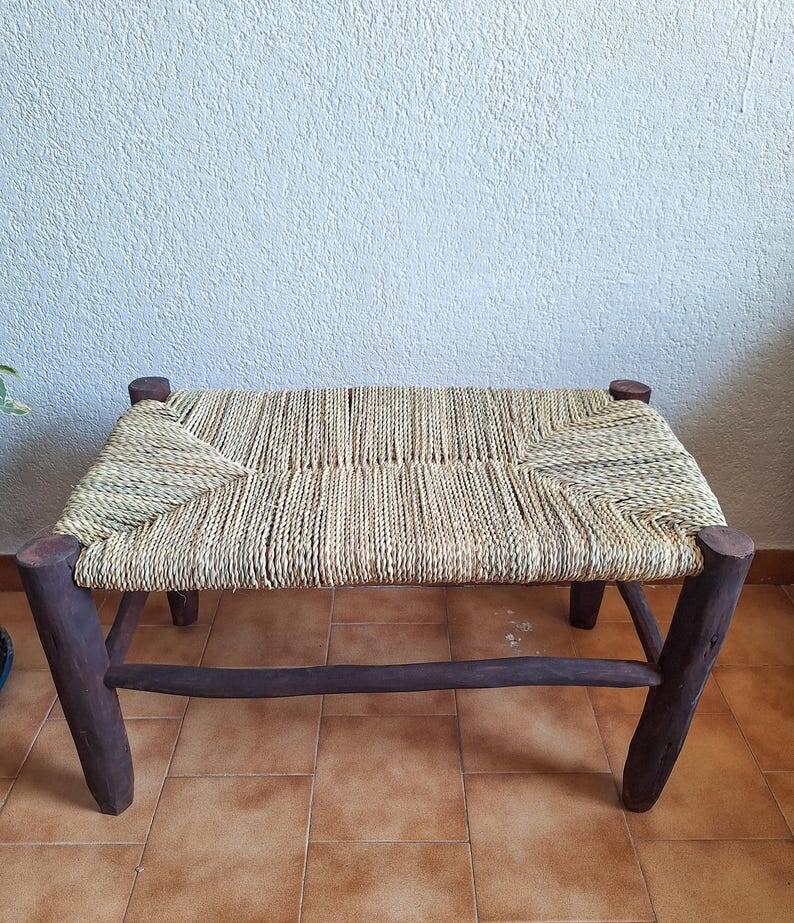 Moroccan bench in dark wood with woven palm leaf seat