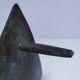 Brutalist metal pocket with patinated tripod