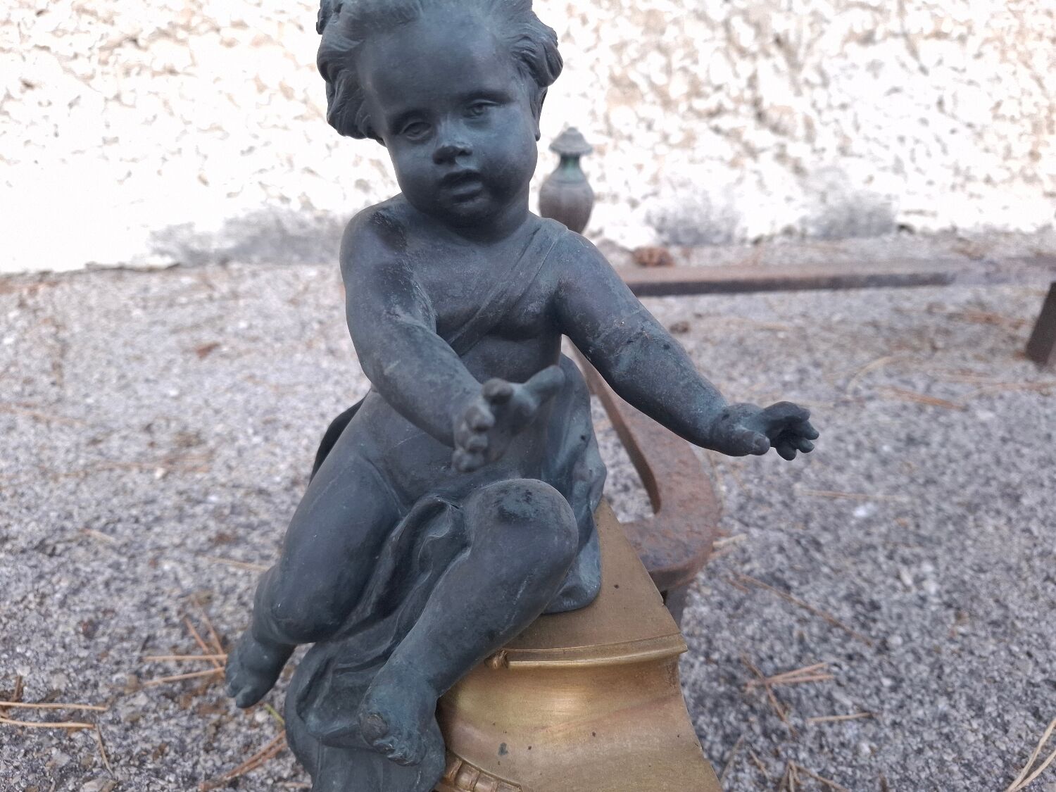 XIXth-century andirons decorated with cherubs and angels