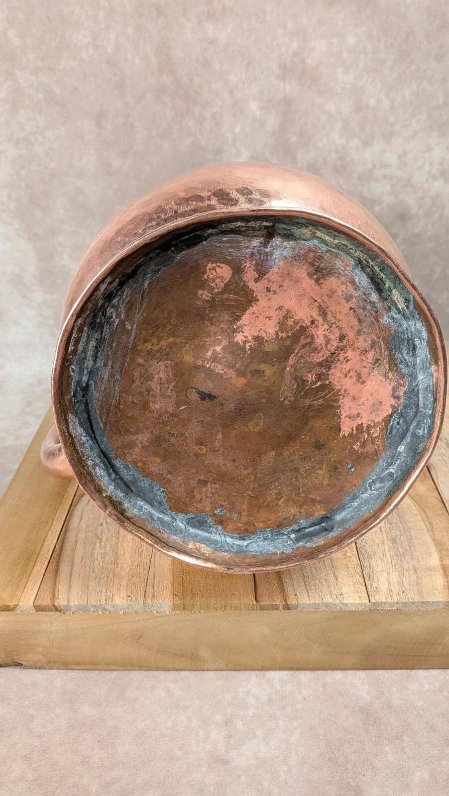 Antique hammered copper jug