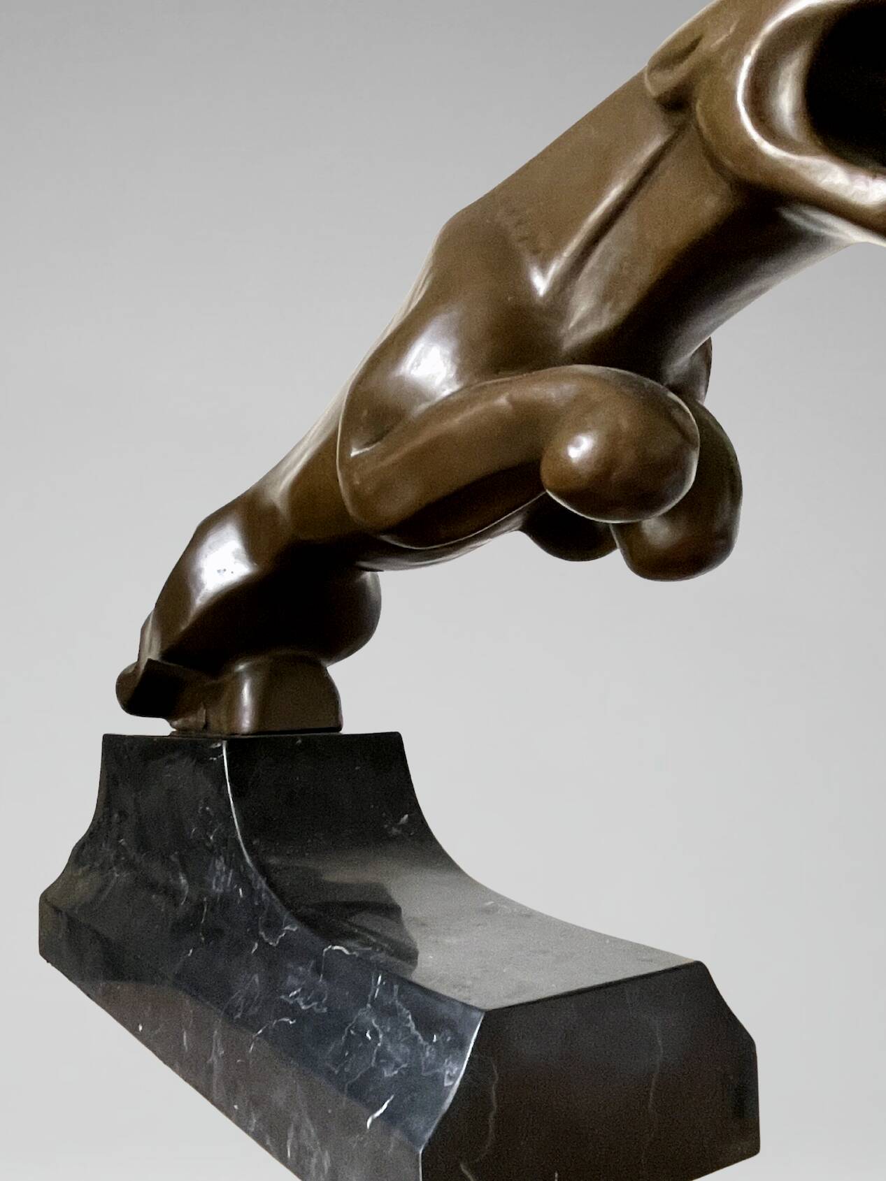 Large Art Deco bronze patinated Jaguar sculpture on an architectural base.