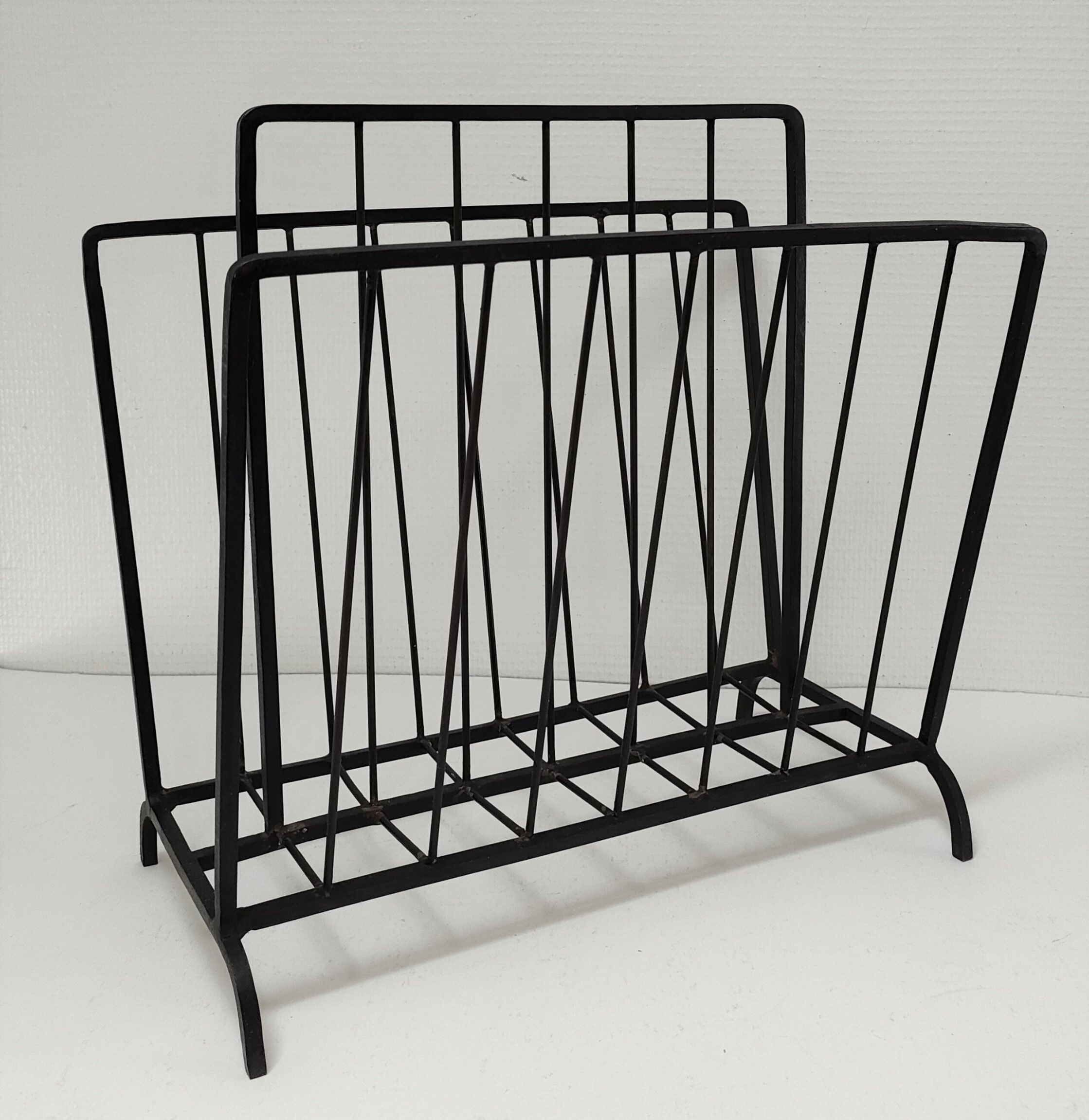 Modernist magazine holder black iron 60s