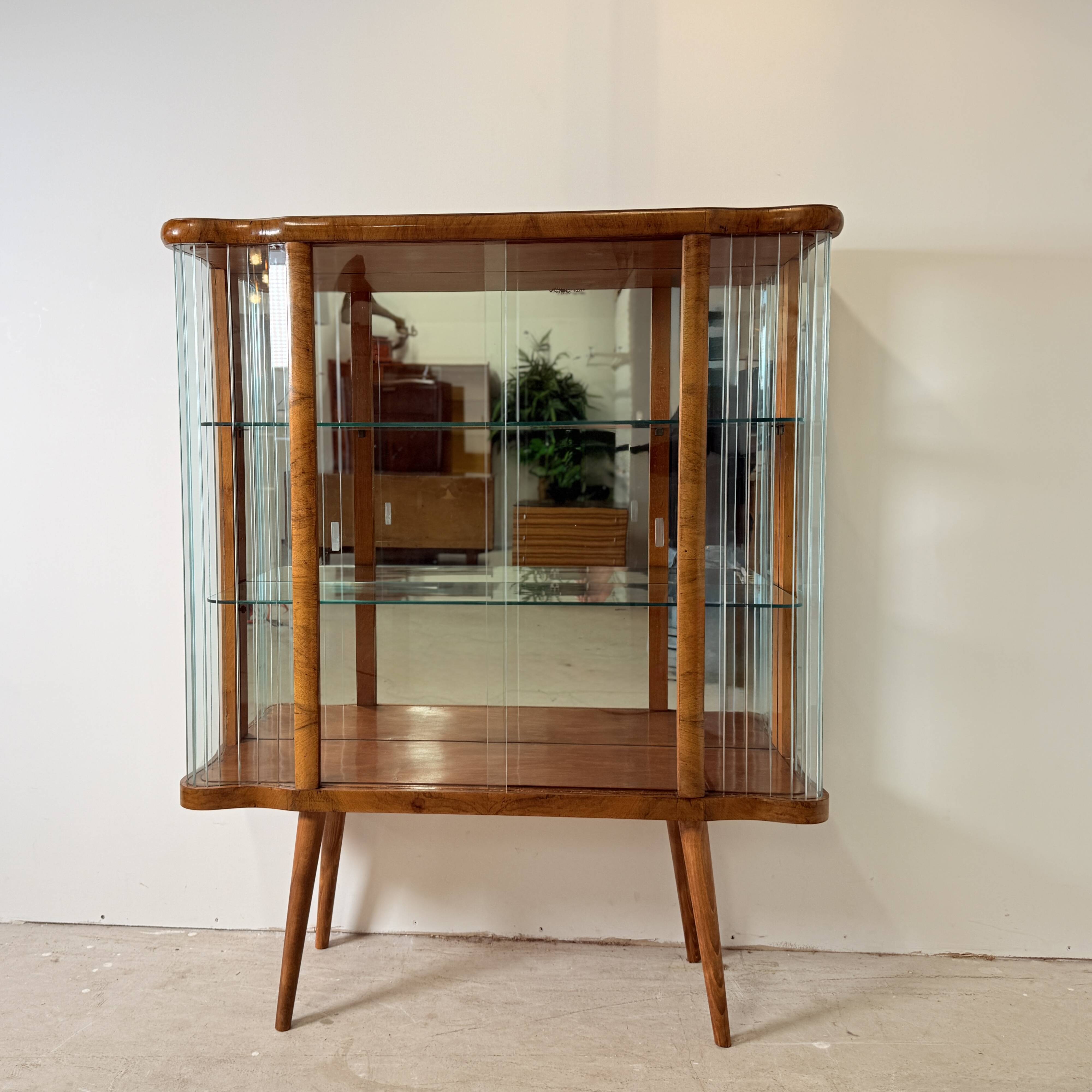 Elegant, curved display cabinet in Art Deco style
