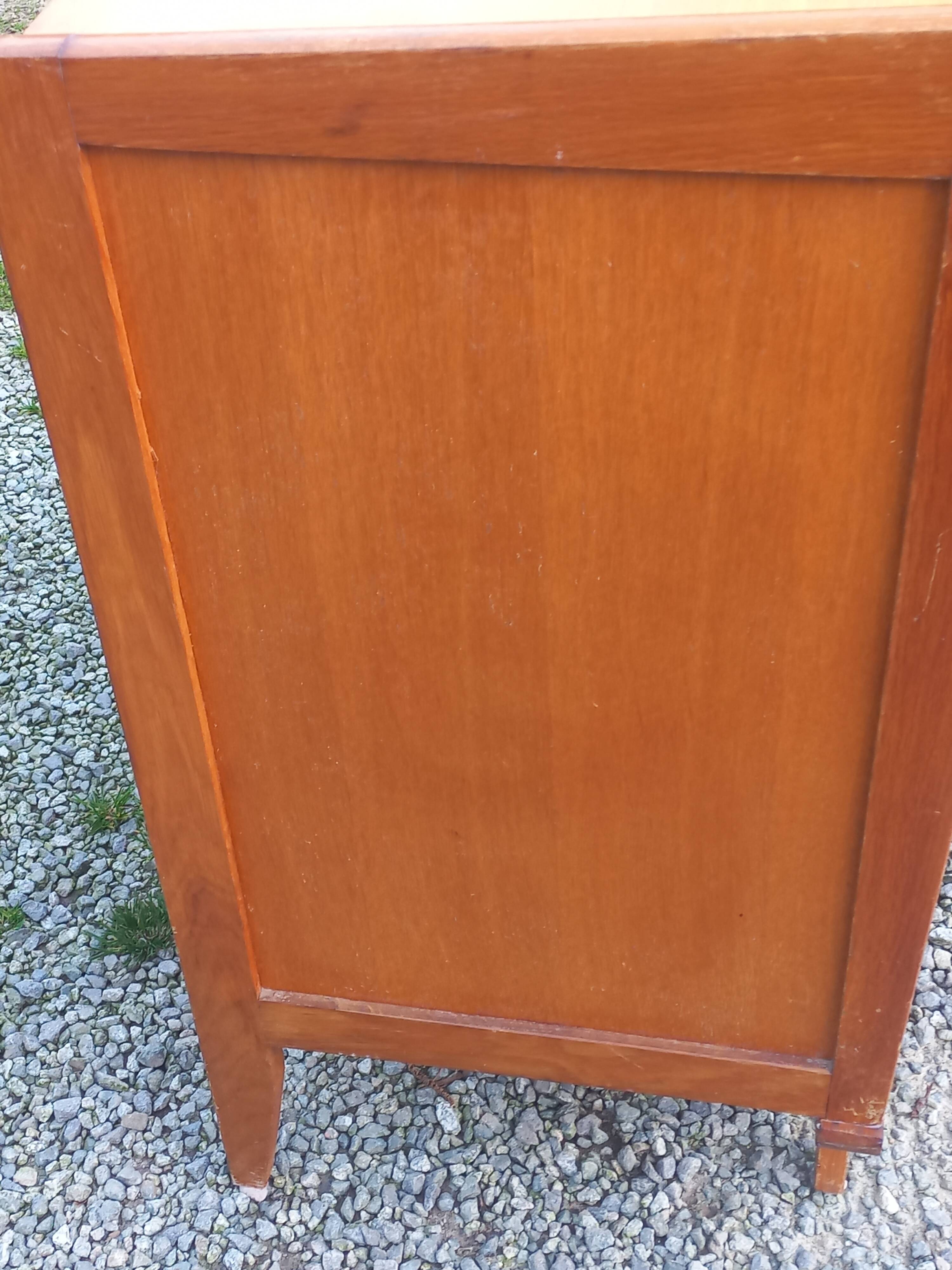 Vintage oak commode with tapered legs and wings from the 1950s.