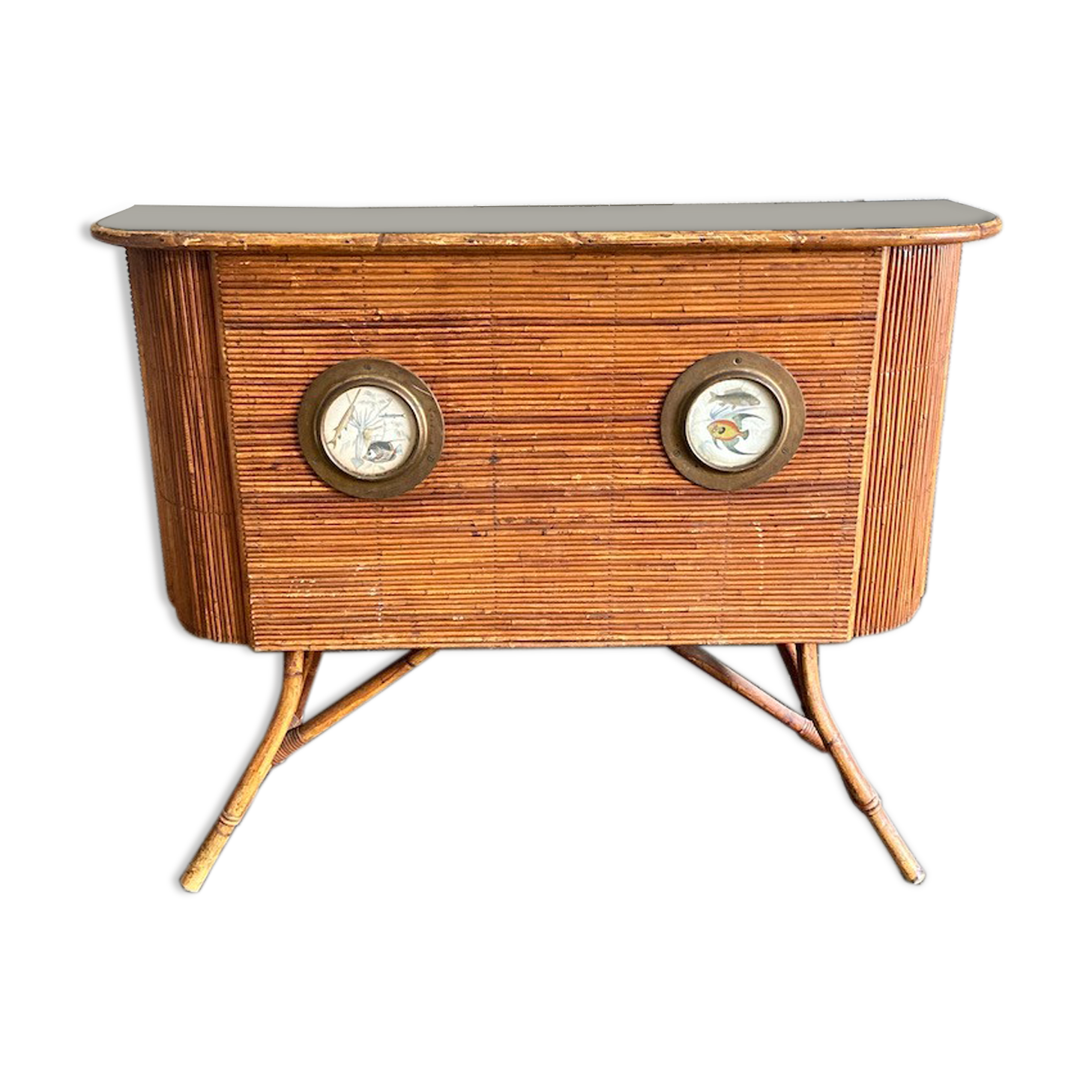 Rattan and wood bar with its decorative brass portholes