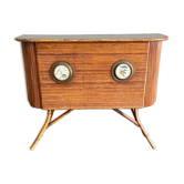 Rattan and wood bar with its decorative brass portholes