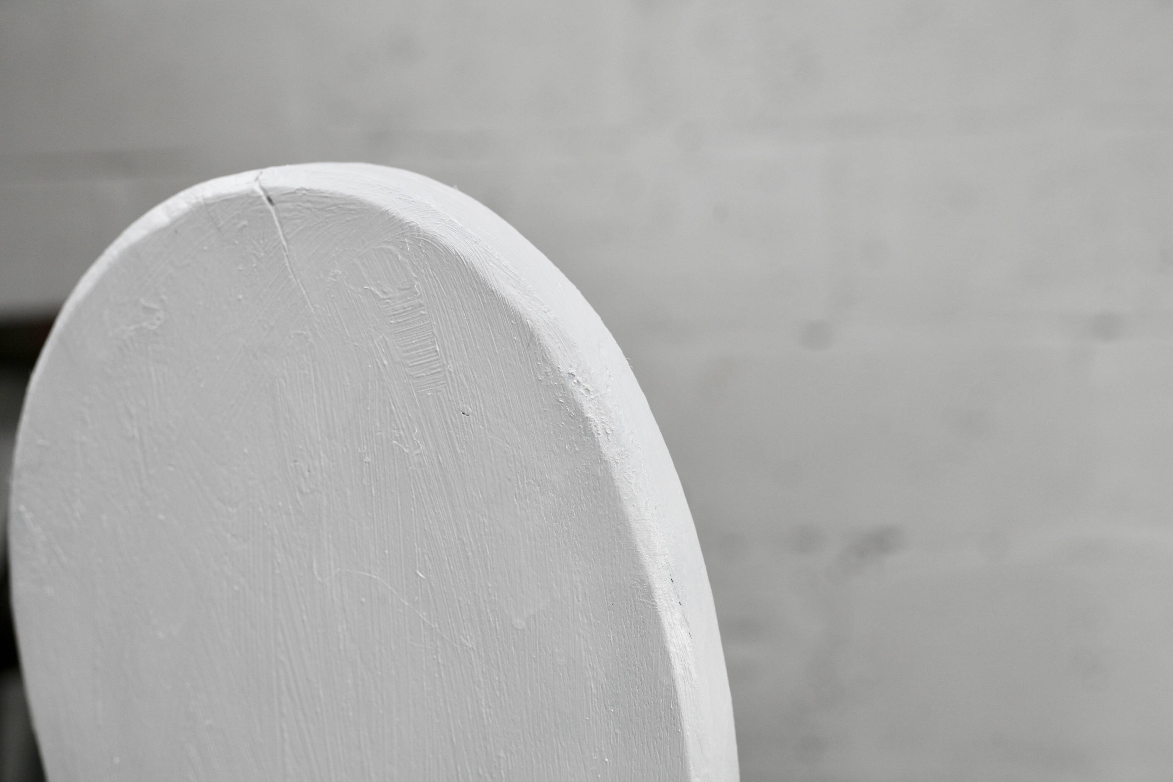 Pair of tripod chairs, gouged seats. Brutalist, circa 1960. Painted wood.