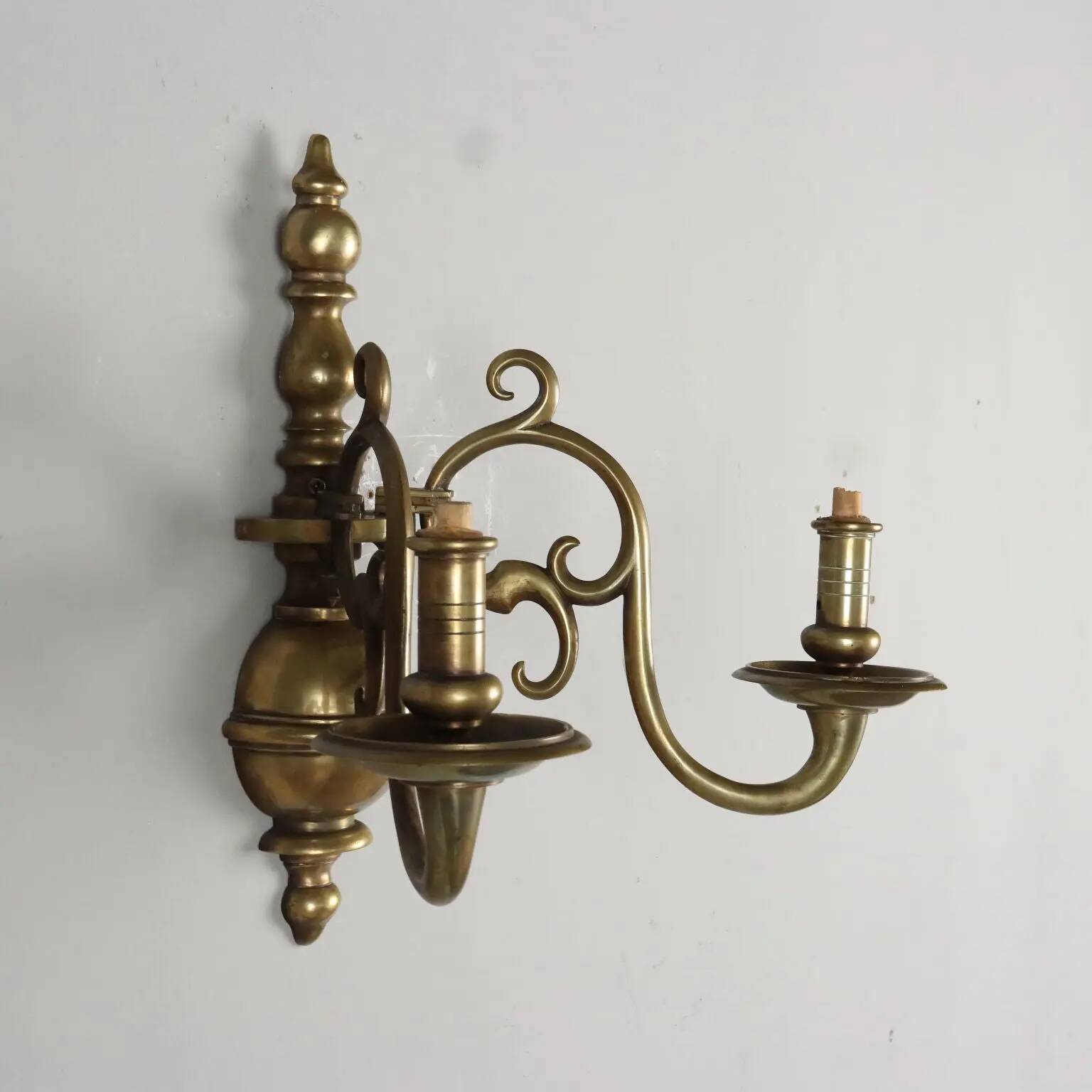 Pair of antique wall sconces in 20th-century Baroque style.