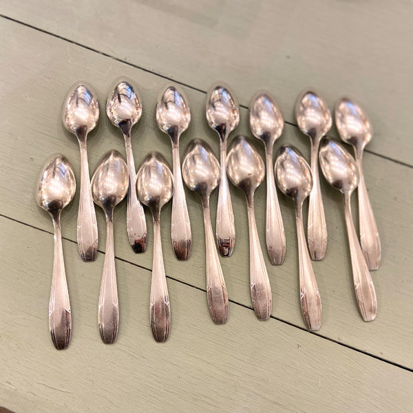 Series of 14 Art Deco dessert spoons, silver metal