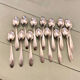 Series of 14 Art Deco dessert spoons, silver metal
