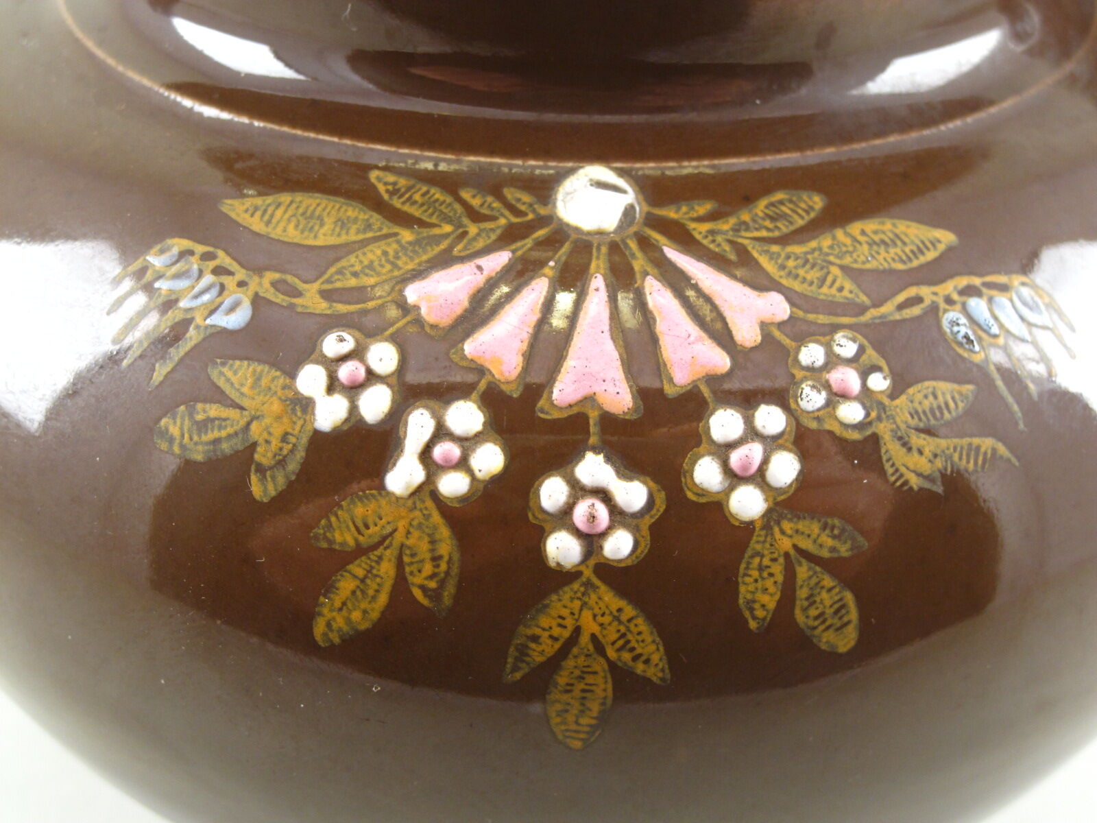 Late 19th century flooring on a brown flower-decorated background