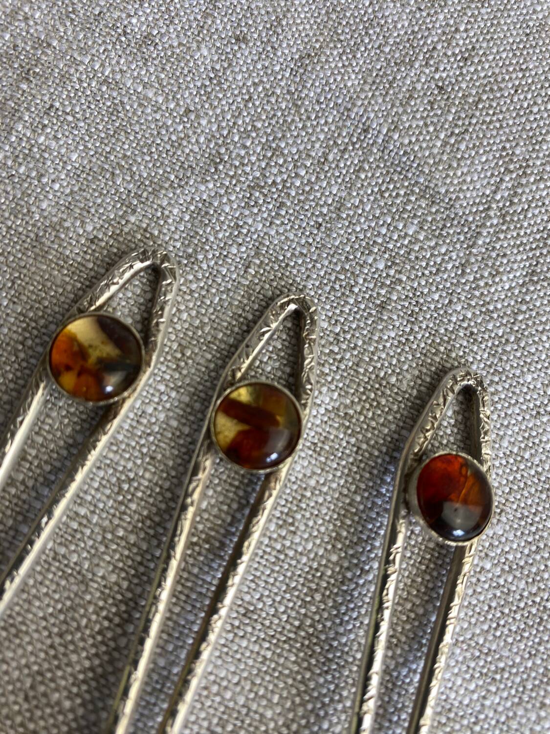 Art Nouveau metal and amber spoons