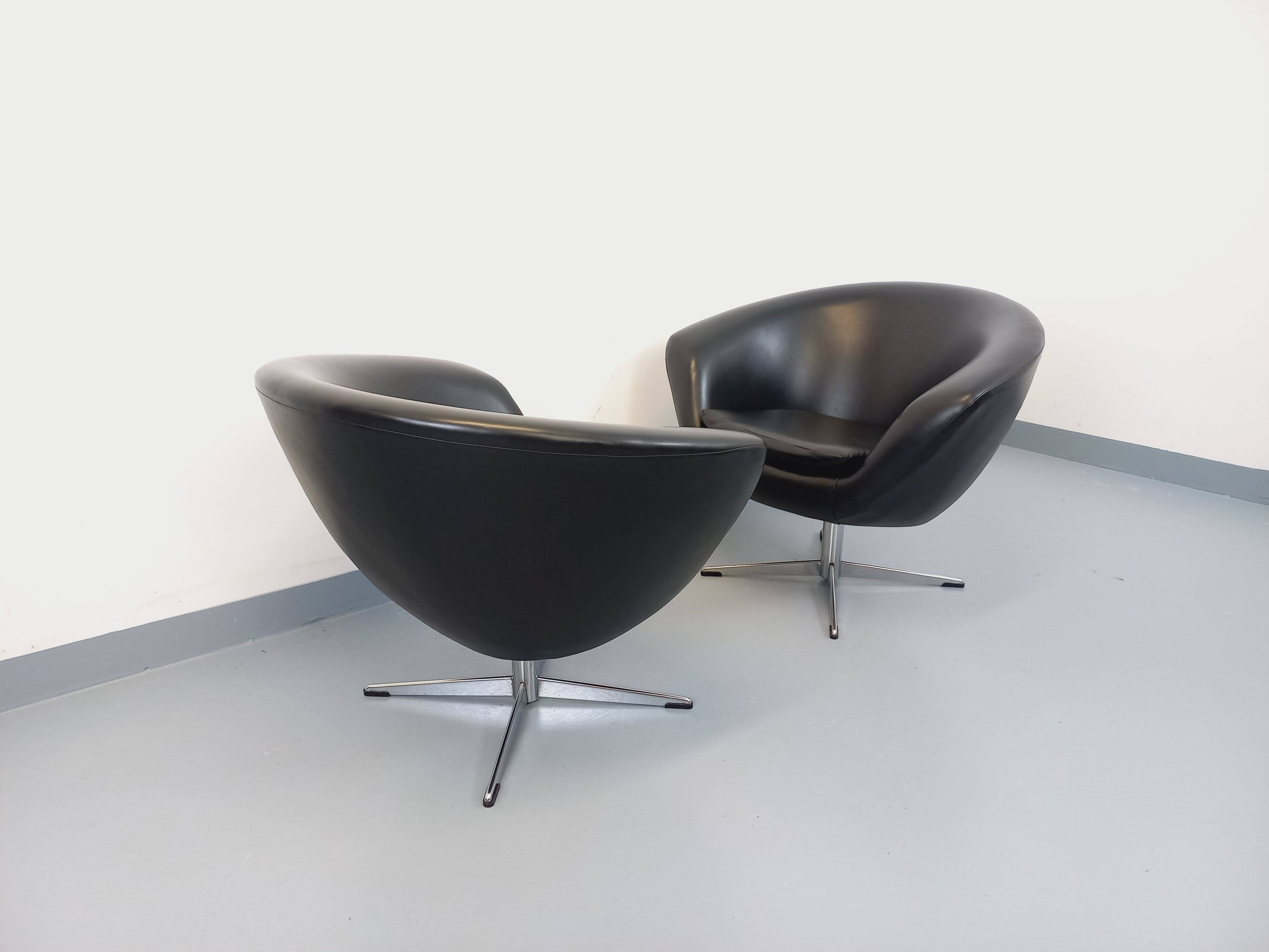 Pair of vintage Scandinavian swivel armchairs in faux leather and chrome.