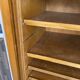 1950s oak office storage cabinet with curtains.