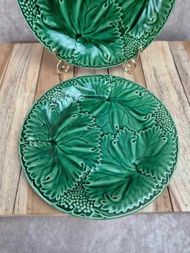Set of 2 green earthenware dessert plates with vine decoration.
