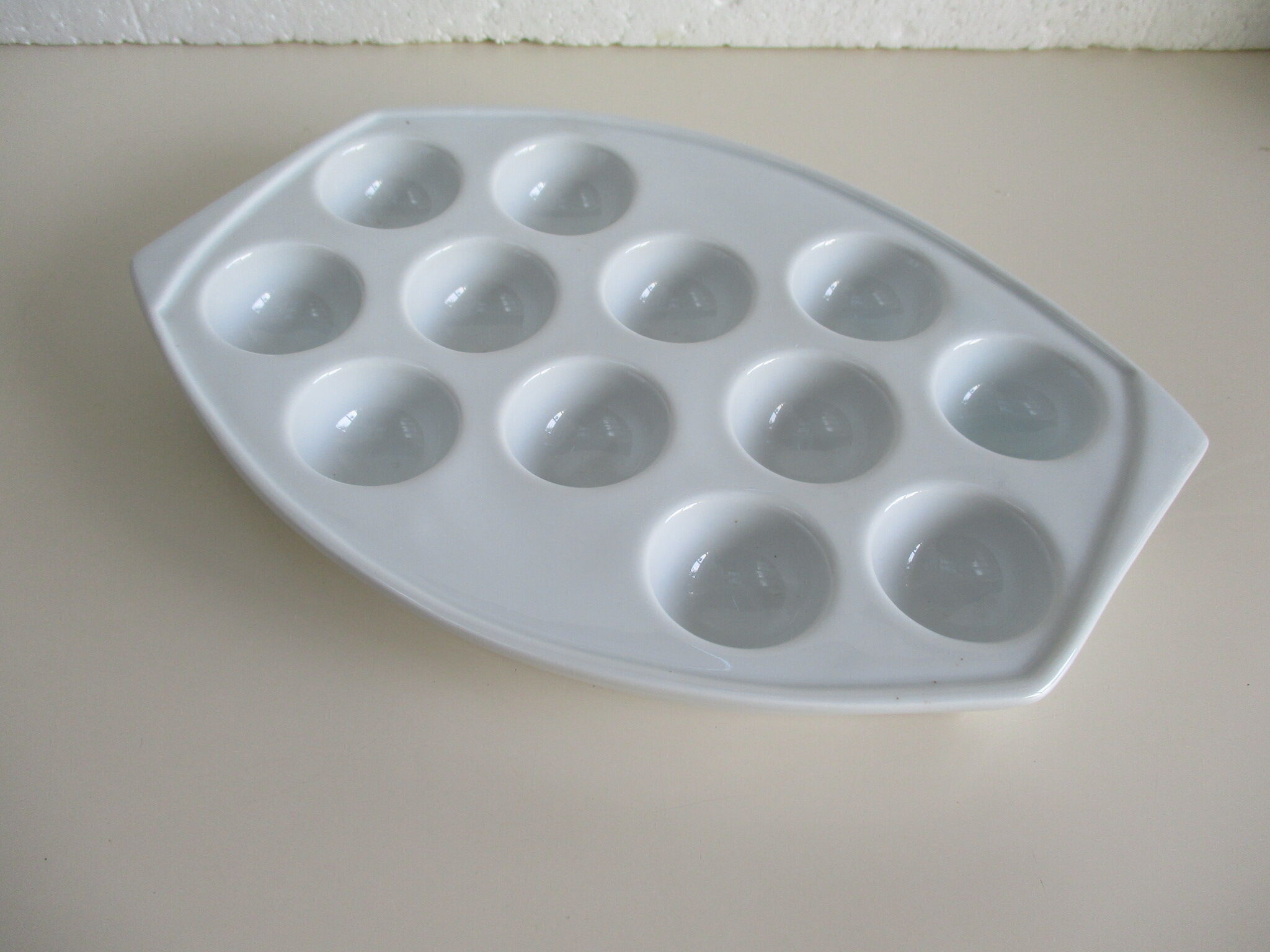 White porcelain snail dish