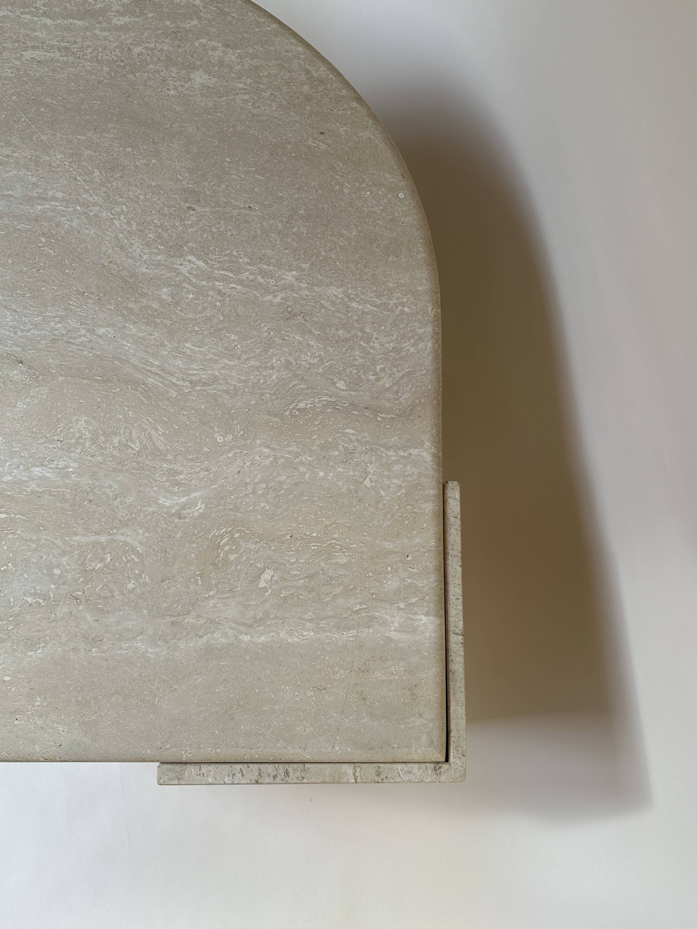 Travertine eye-shaped coffee table