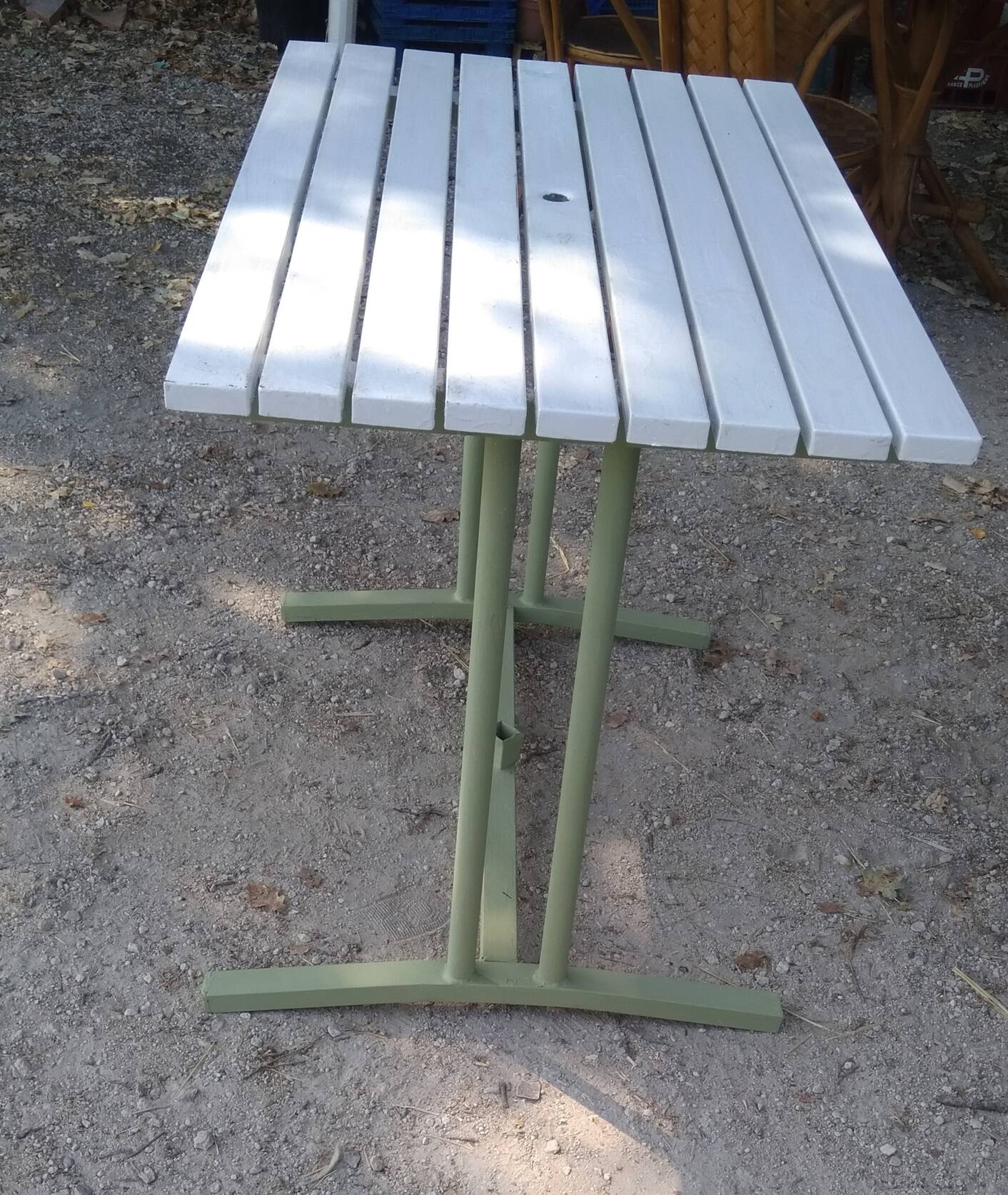Old garden table with iron slats