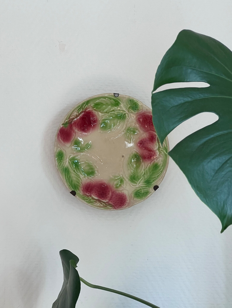 Plate in slip decoration strawberries and leaves