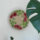 Plate in slip decoration strawberries and leaves