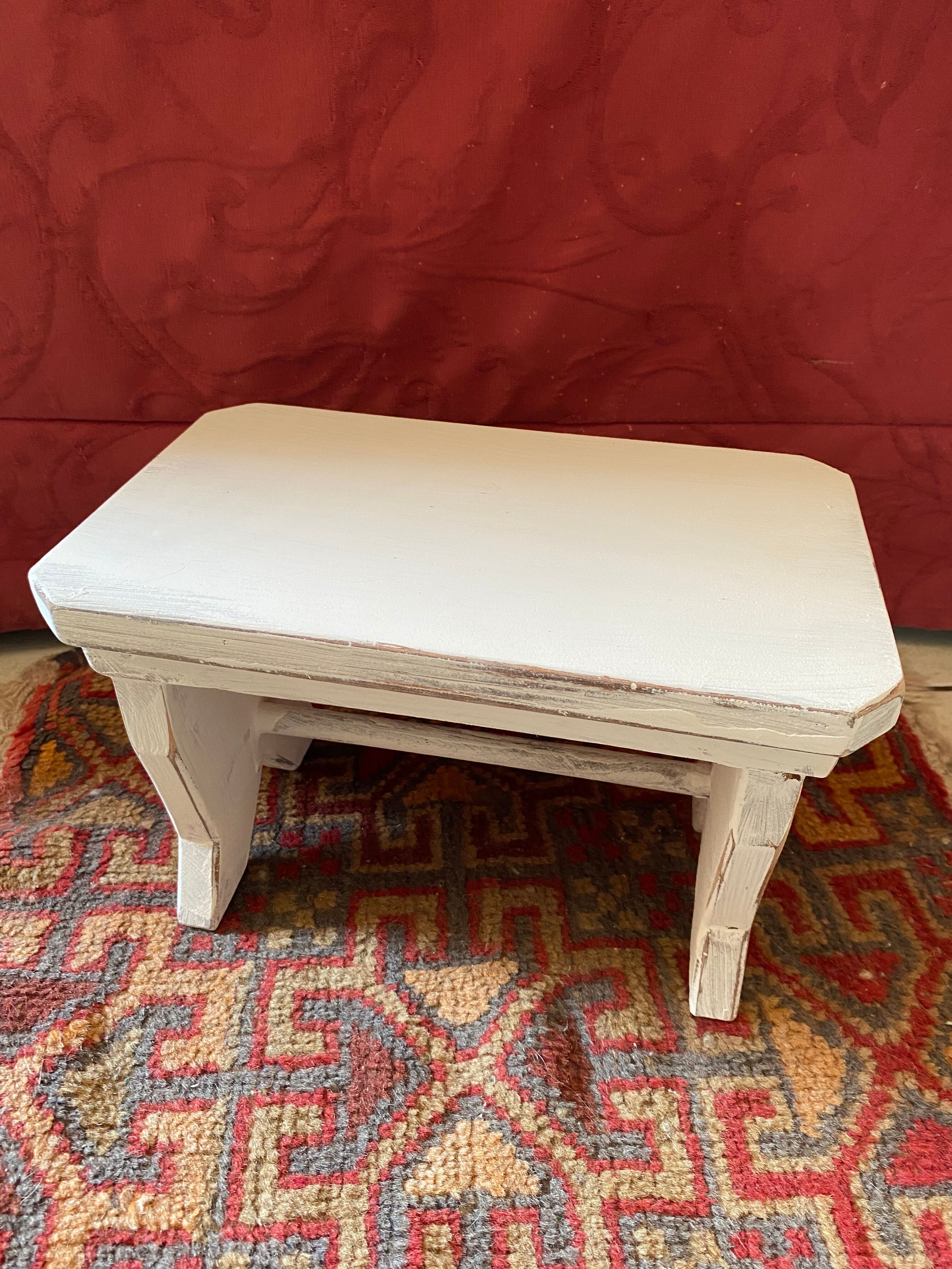 Patinated wooden footrest.