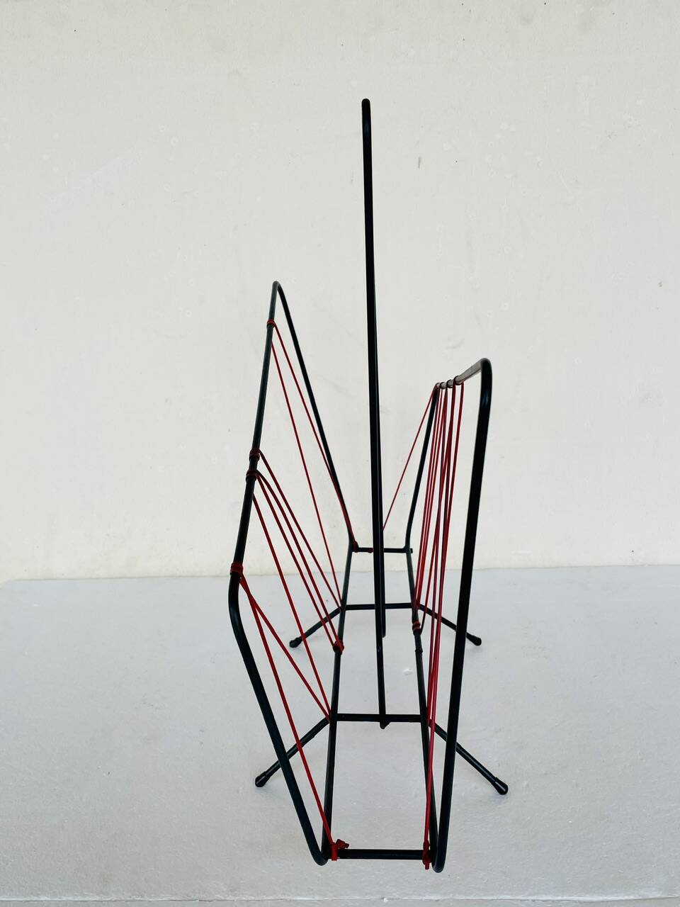 Vintage black metal magazine rack circa 19