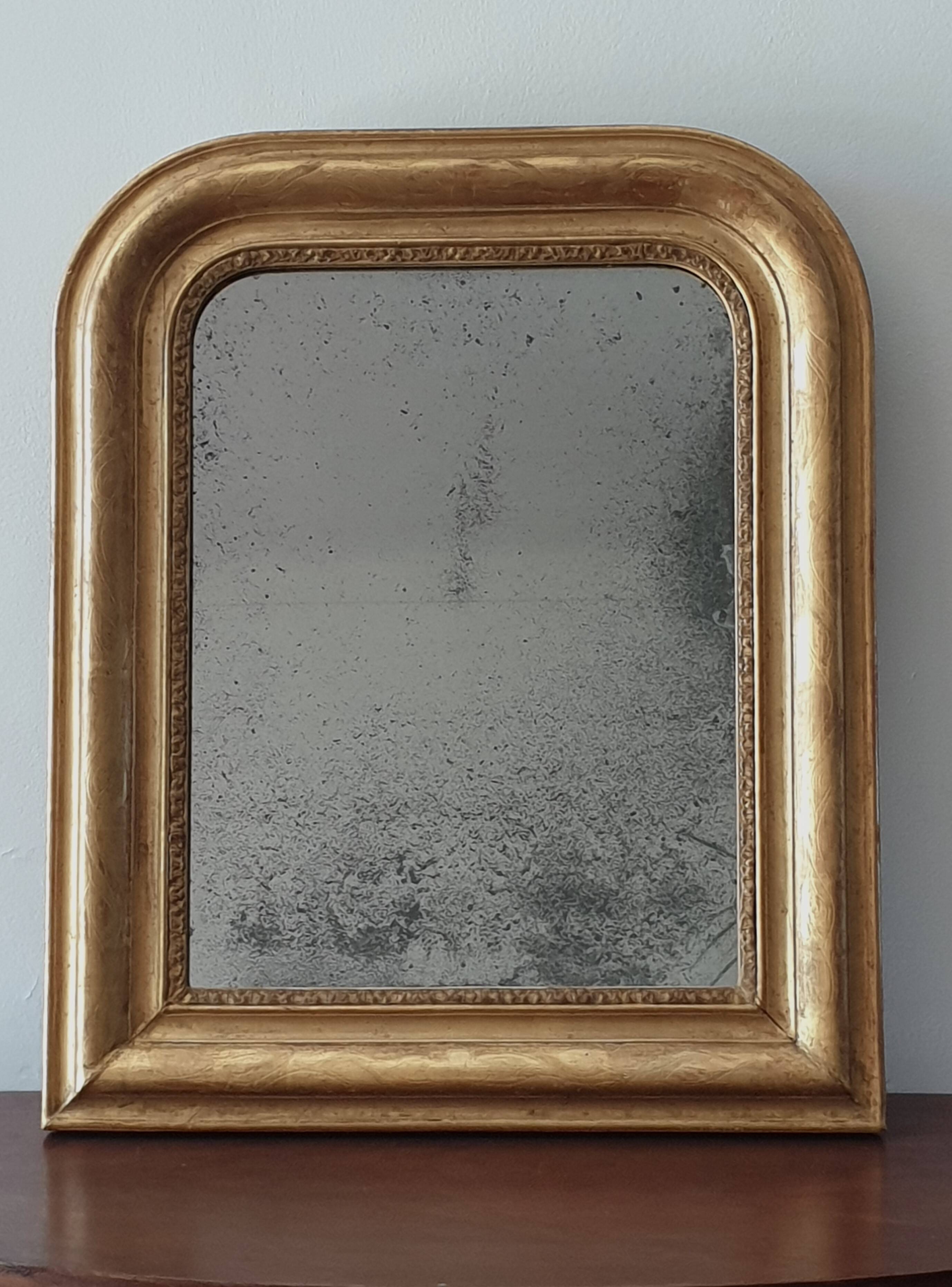 Old gilded mirror and old mercury glass - wall mirror with gold leaf
