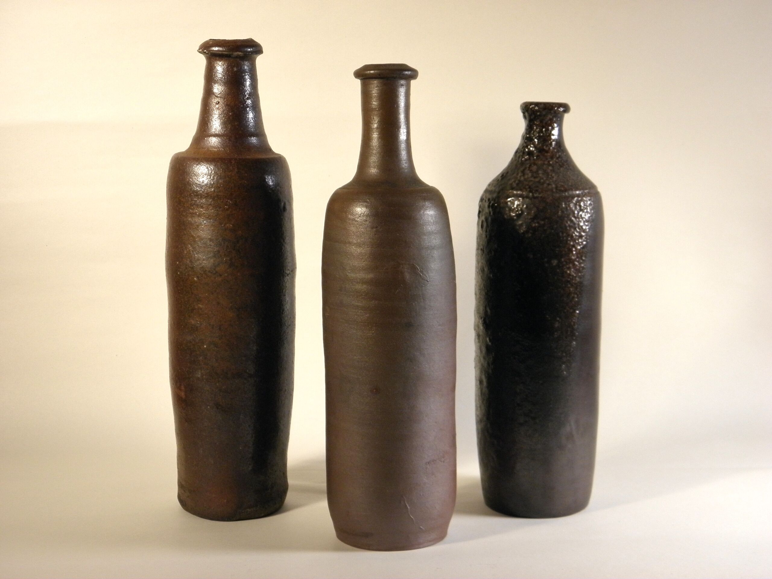 Lot of three old sandstone bottles