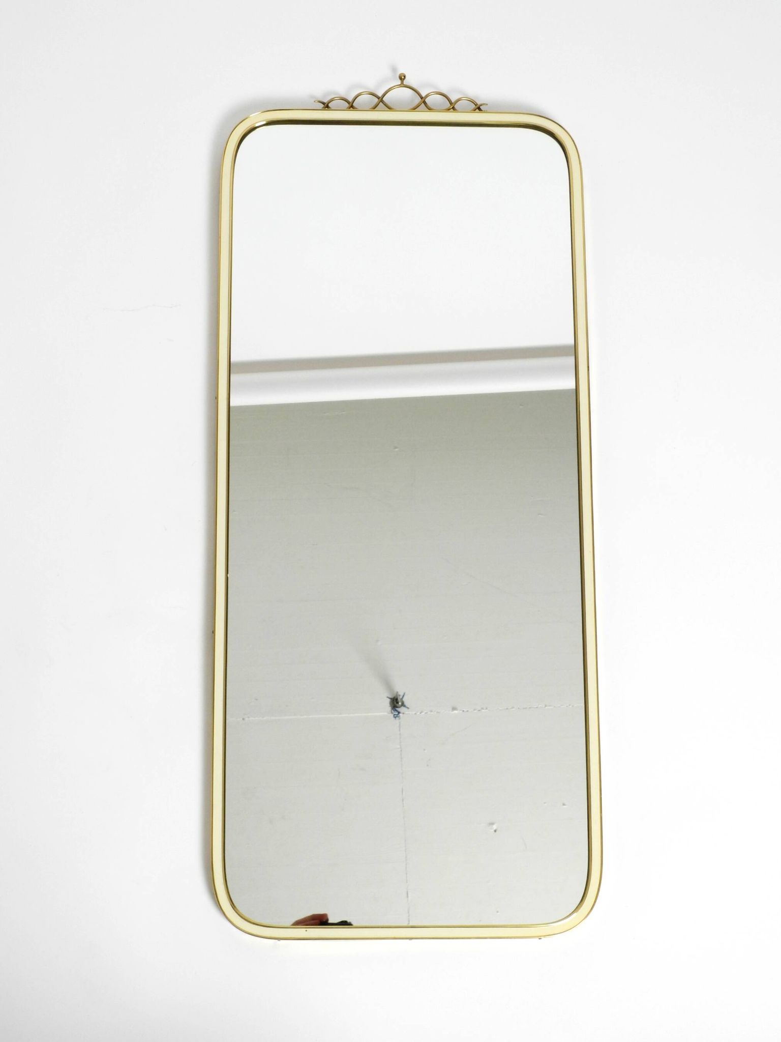 Large heavy long Mid Century brass wall mirror by Münchner Zierspiegel
