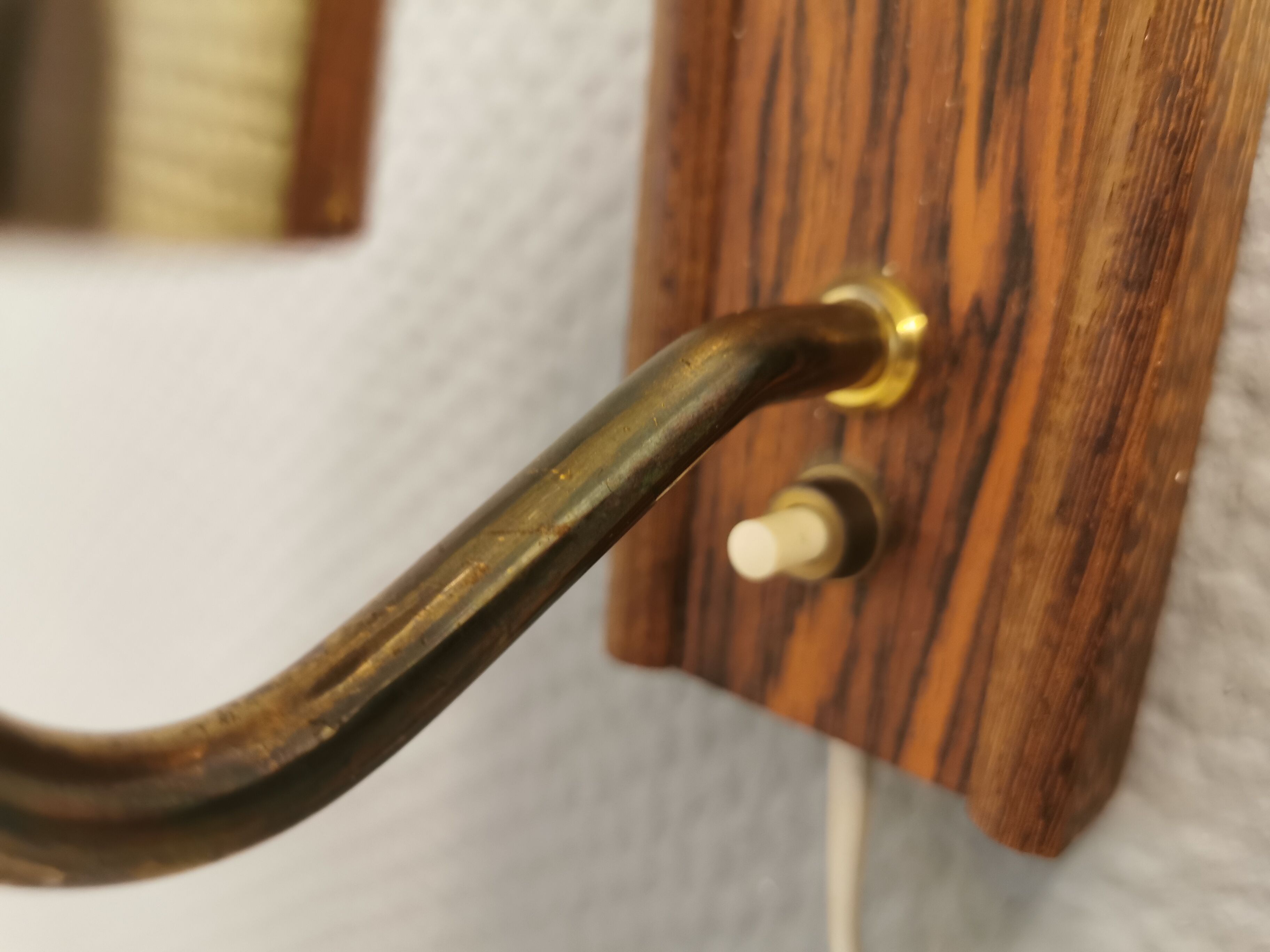 Wall light in rosewood with bobble glass ball shade.