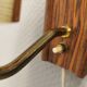 Wall light in rosewood with bobble glass ball shade.