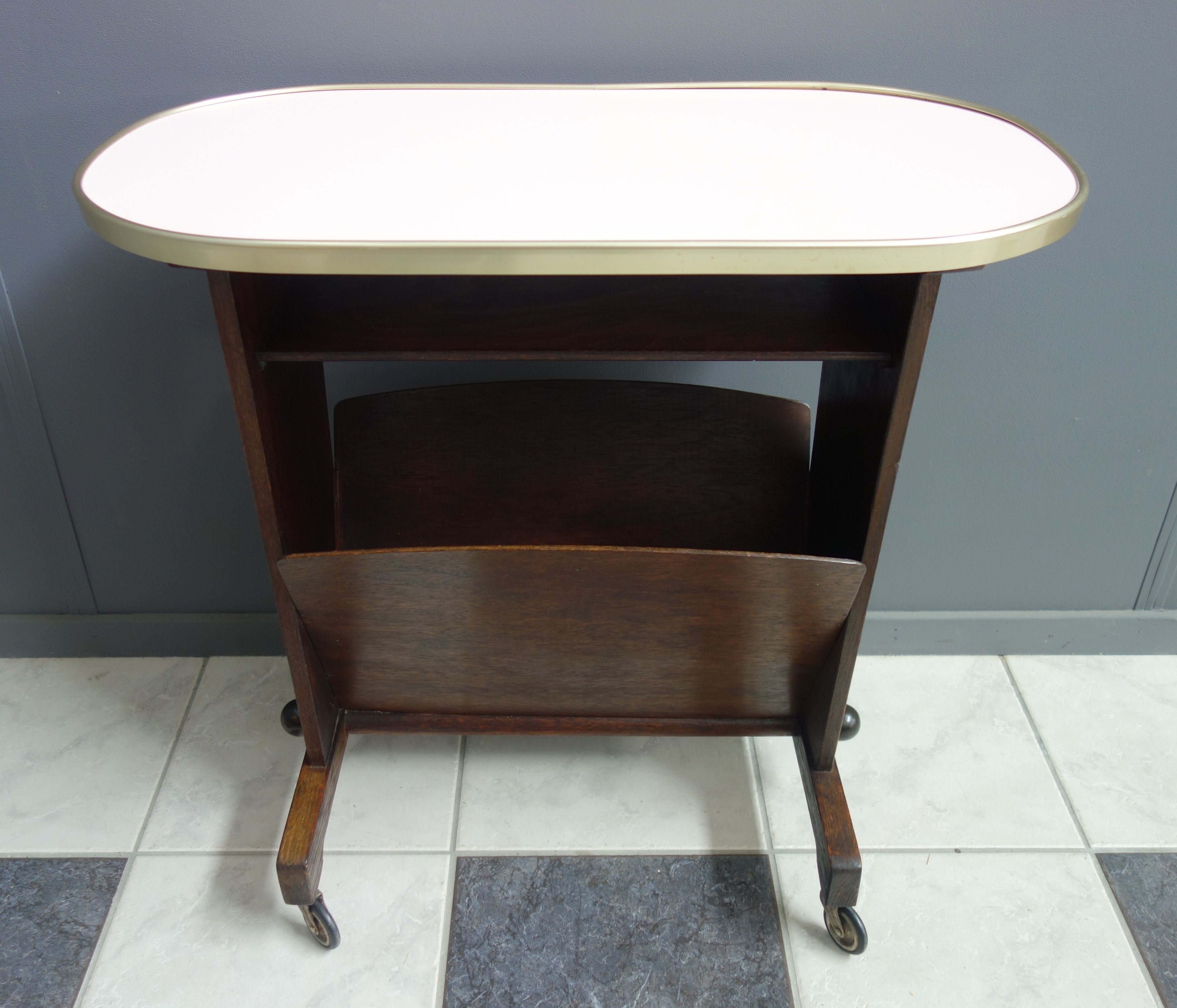Pink formica magazine table 1950s