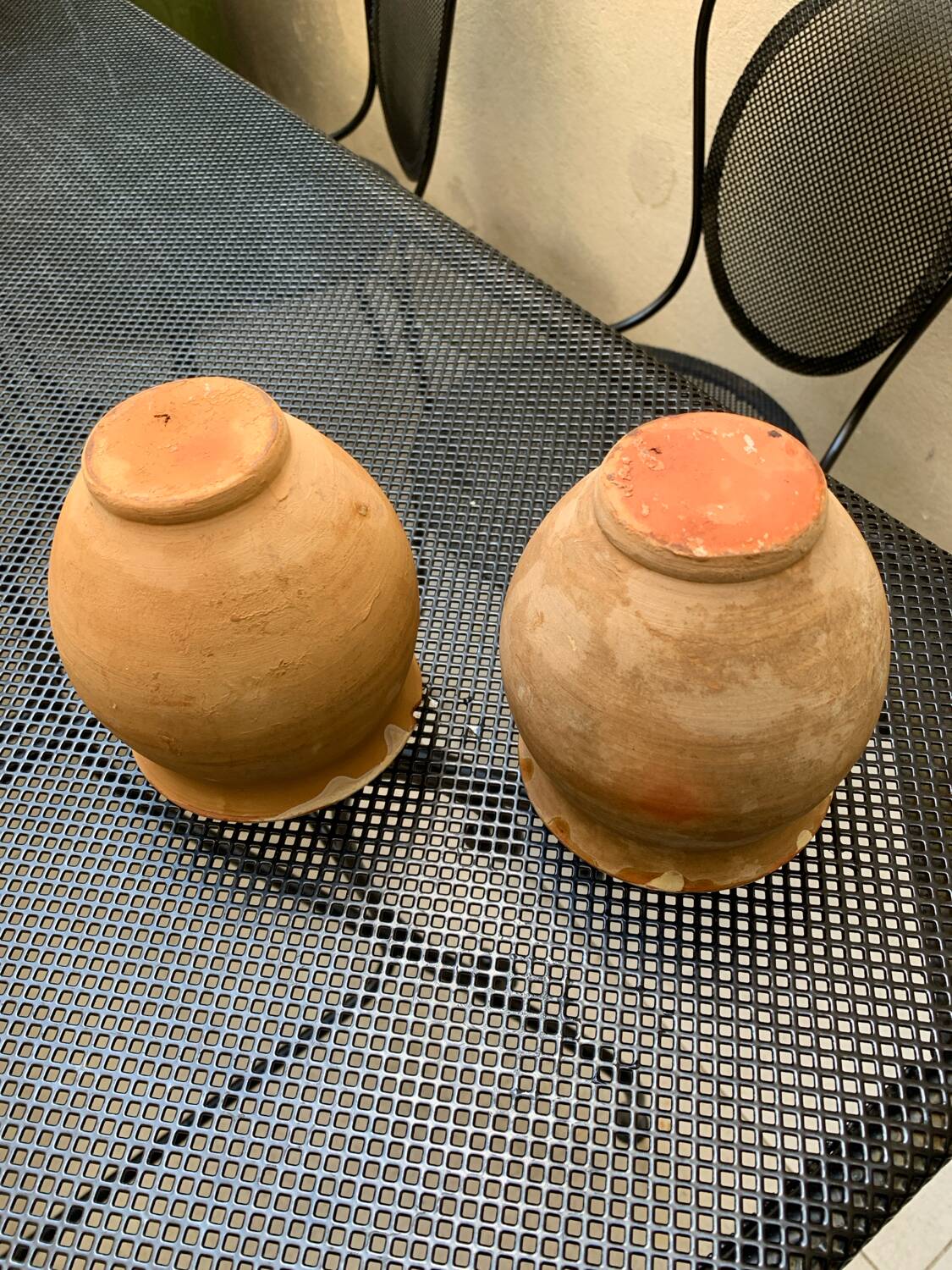 Pair of terracotta and ceramic pots
