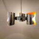 Hanging lamp in chromed metal with orange contrast lacquer and three light sources.