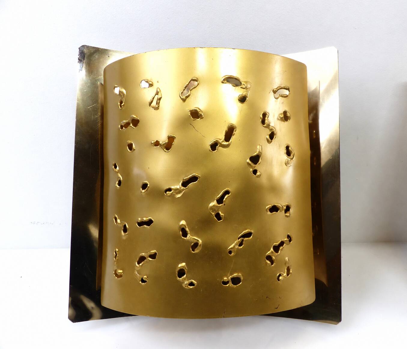 Pair of brutalist wall lights Boréns model 6477 in perforated brass – Sweden