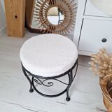 Black iron stool/pouf with its boucle fabric cushion.