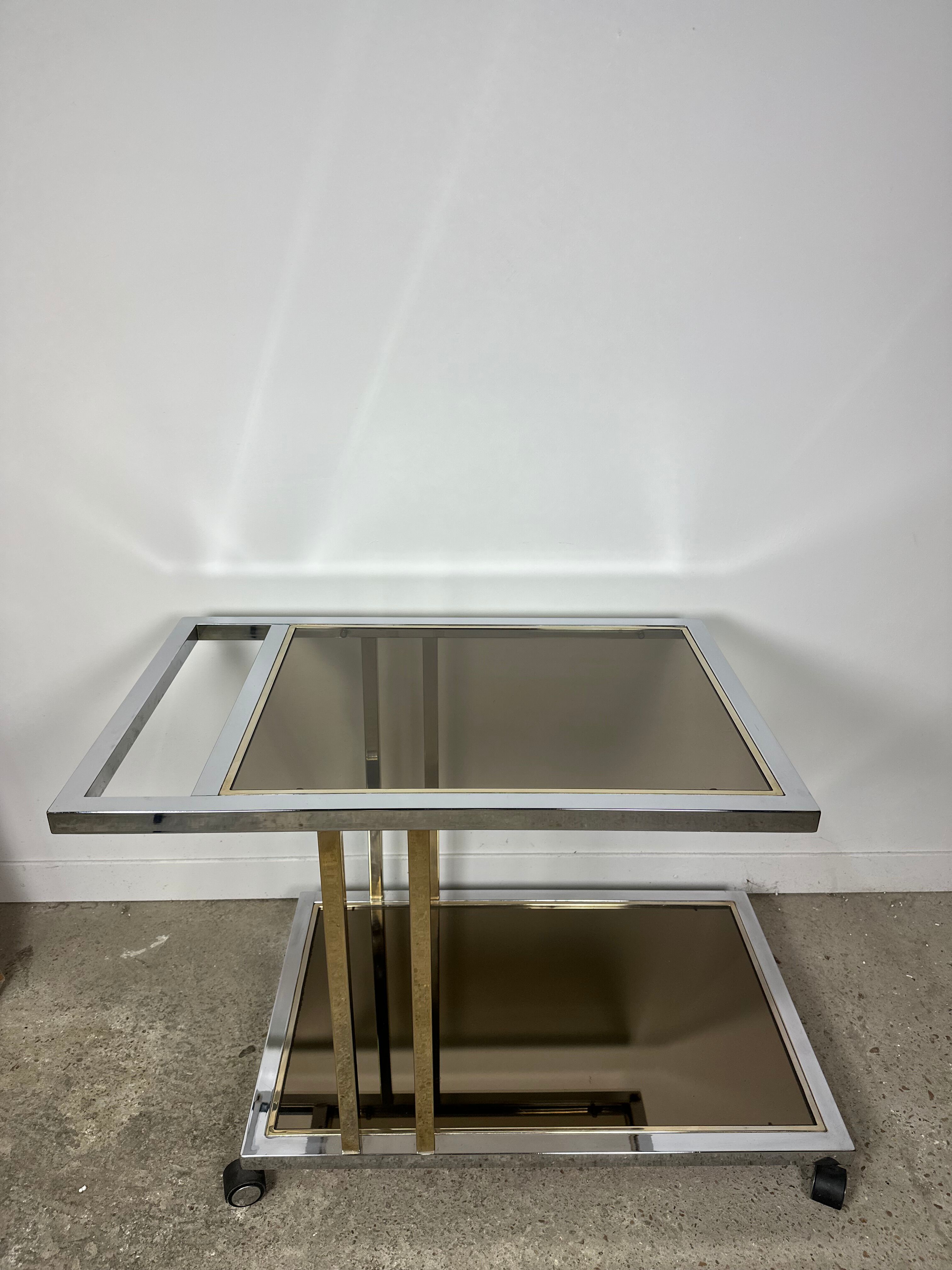 Belgo chrome serving cart/rolling table in chromed and gold-plated brass, 70s