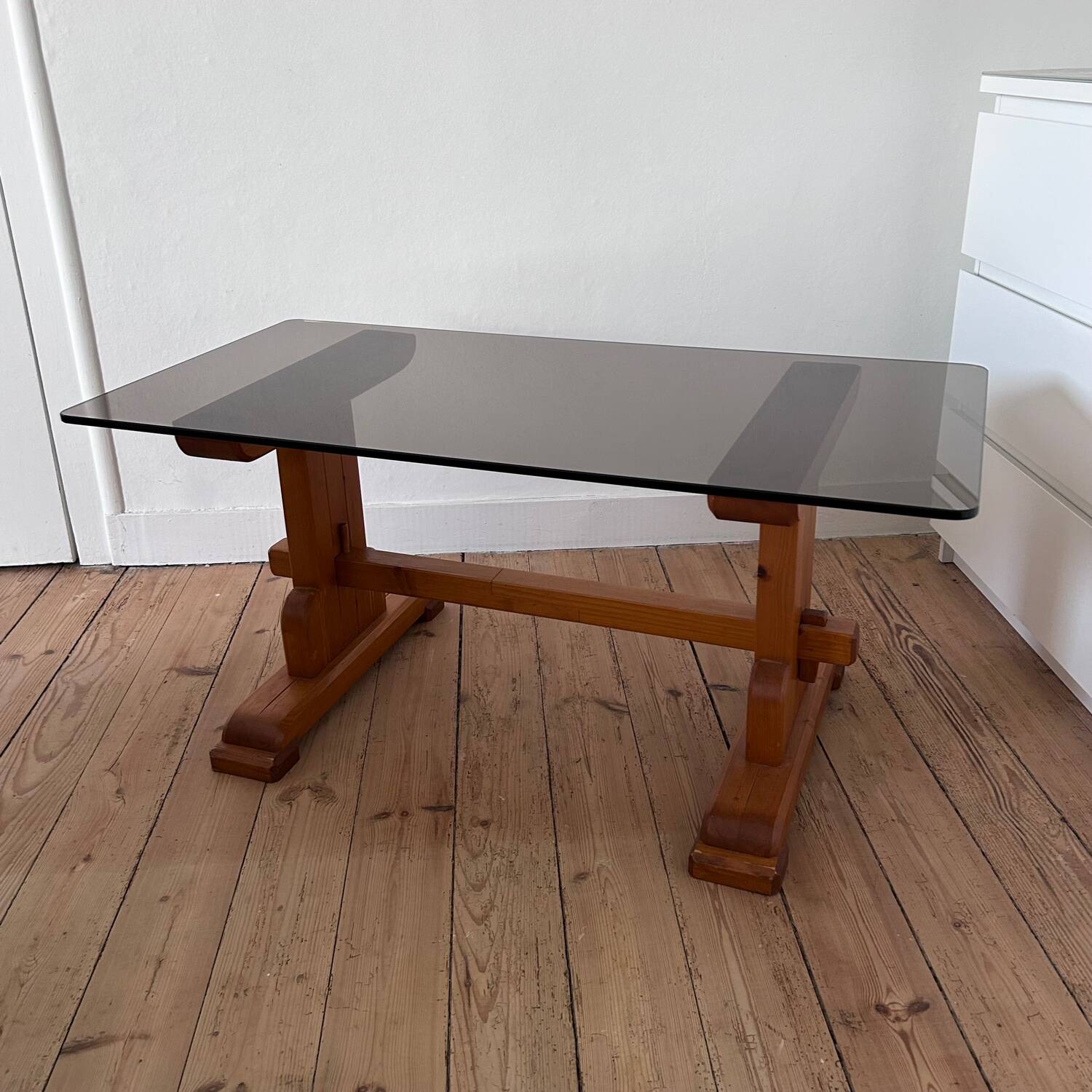 Pine coffee table with smoked glass top.