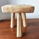 Vintage Danish brutalist tripod stool made of solid oak.